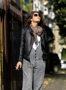 Amazing brunete is smoking on the street before posing nude at home